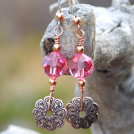 The copper filigree daisy charms used in the handmade earrings have a lacy look, which, when combined with the pink Swarovski crystals, create a very feminine pair of earrings. One of a kind copper filigree flower and pink Swarovski crystal earrings.