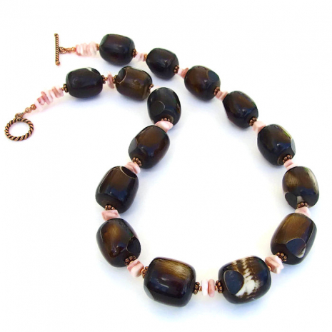 The handmade "Kalahari" necklace is chunky in design but it is actually light in weight due to the bone beads. One of a kind bone and shell handmade artisan necklace.