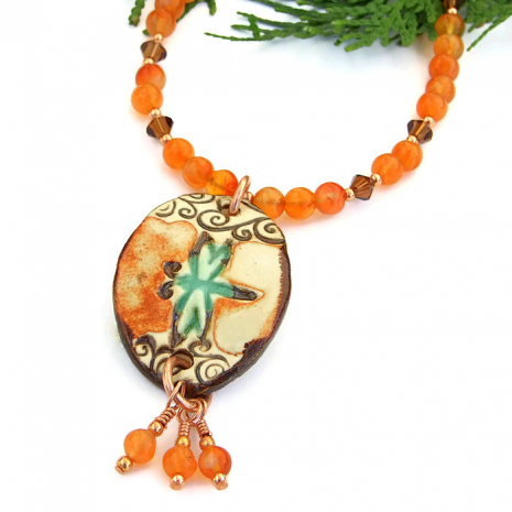 Handmade ceramic dragonfly pendant necklace with gemstones.